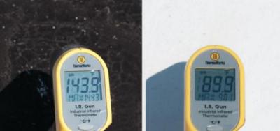 On a summer afternoon, the black roof at left was measured to be 30ºC (54ºF) warmer than the white roof at right. (Image courtesy of the U.S. Department of Energy)